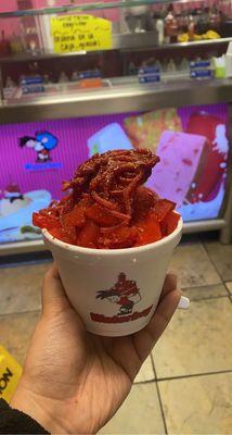 Watermelon snow cone with koolaid pickles, Lucas salsagheti sandia candy, chamoy and tajin