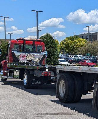 Loading large equipment onto Flatbed trailer