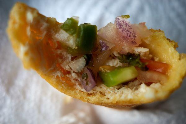 Chicken empanada (interior plus fresh pico de gallo)