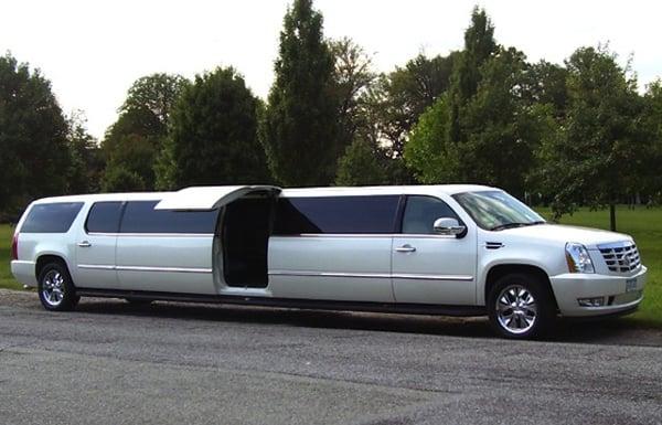 18 - 20 Super Stretch Cadillac Escalade with a LEAR-jet door!