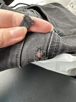 Pant loop broken on a pair of black skinny jeans.