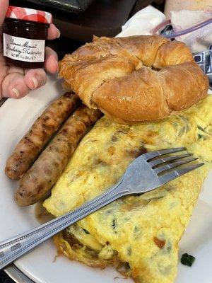 Breakfast omelette made to order, sausage and a croissant with a cute jar of preserves