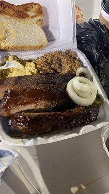 Cajun rice, potatoes salad and ribs