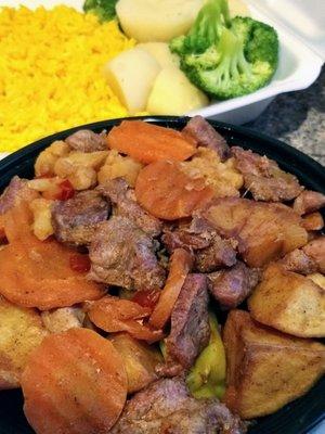 Pork picadinho with sides of rice and veggies