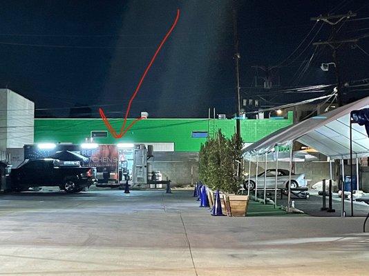 The unmarked/unbranded food truck hidden in a car rental parking lot where Krispy Rice is served.