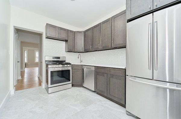 Kitchen renovation. Porcelain floor, ceramic subway tile.