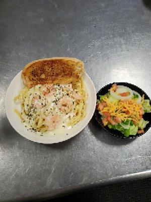 Served Friday evening fish fry: Shrimp Scampi with a side salad and garlic bread