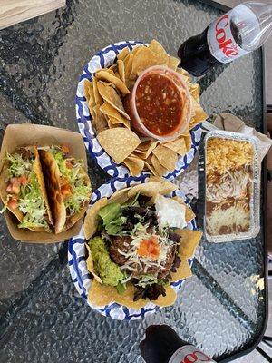 Chips and Salsa, tacos, taco salad, & pork enchilada with rice & beans