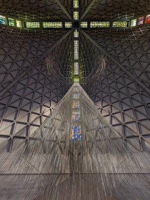 inside, giant roof with nice chandelier and stained glass.