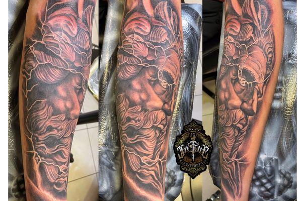 Zeus with lightning Greek god tattoo by josue almanegra tattoo studio snohomish lake stevens wa Everett tatuaje