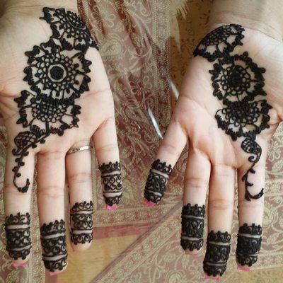 one of our henna with client both hands