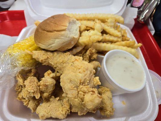 Chicken Strips lotsa fries, Big corn on the cob, Country gravy. Wished they had buttermilk biscuits it would better with this chicken!