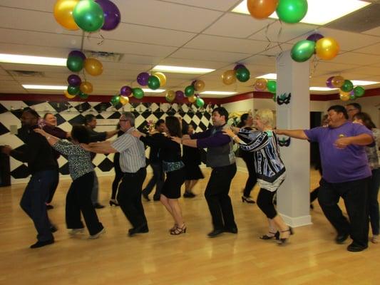 Conga line at weekly practice party