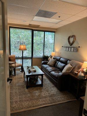 The counseling office of Healing Your Heart Counseling which overlooks the atrium filled with trees and a fountain- the waters are stirring!