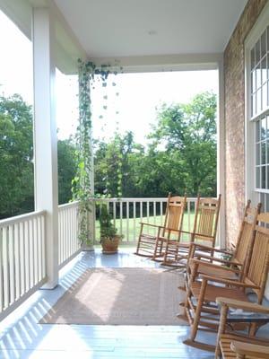 Porch around the back side of the house