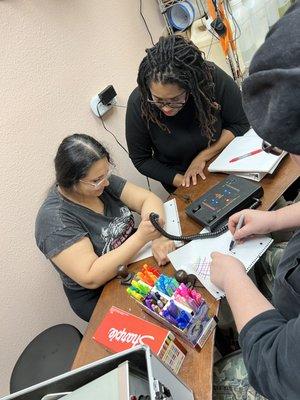 Sigel teaching esthetician students Intro to Lasers class.