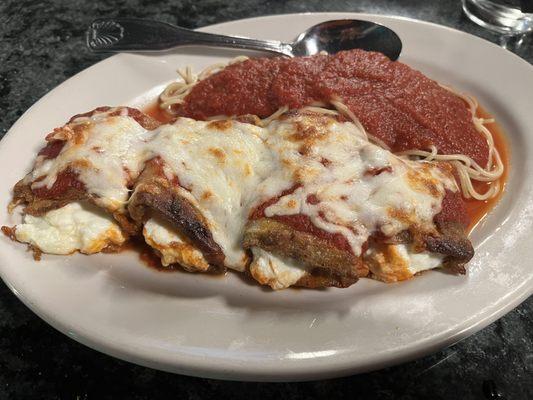 Eggplant Rollitini with side of spaghetti.