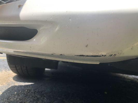 Damage to the front bumper cover due to the accident.