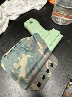 Custom kydex holster. Client requested Camo pattern . Graphics printed in house.