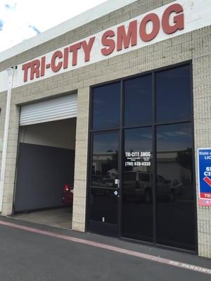 Front of Tri City Smog. It's a little tucked away behind other buildings and in between a cross fitness place.