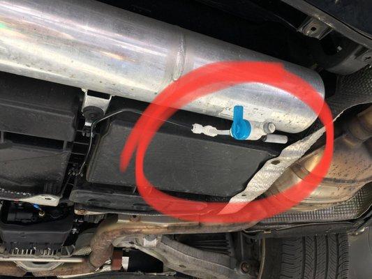 He removed the underbody panel and found the valve we have circled on the photo.  this is something that would be purchased at Home Depot