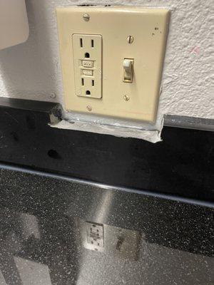 Broken outlet with unappealing carpentry