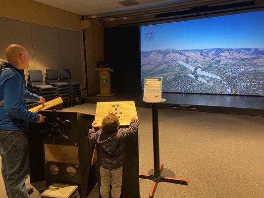 Flight simulator for the older kids to fly a plane.