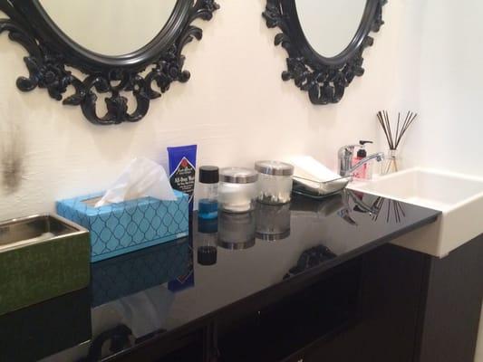 Station for washing your hands, face, & removing makeup. Cleanser, eye makeup remover, cotton pads and qtips available