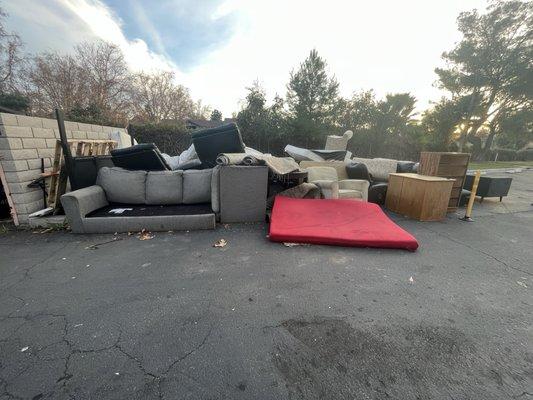 Parking lot. Illegal dumping and maintenance/ staff dump items here every day