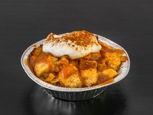 Warm apple cinnamon bread pudding with salted caramel and whipped cream *flavor changes seasonally