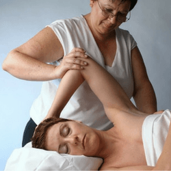 Marzena K. working with a massage client