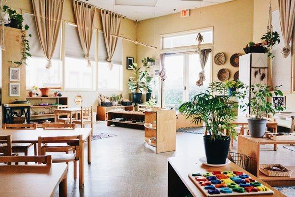 A beautifully set-up space encourages more learning and discovery! A view of our toddler classroom (ages 2 - 3 years)