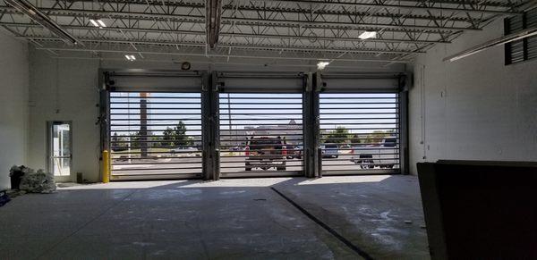 AV Overhead Garage Door installed Rytec High speed glass in local car dealership 630-513-9050 garagedoorwebsite.com info@garagedoorwebsite.