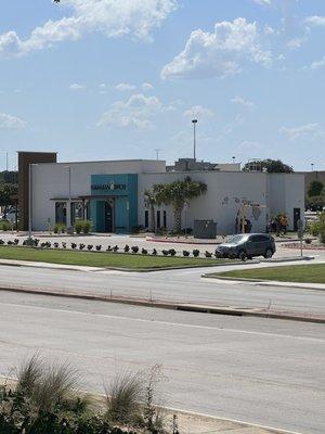 Frontage road on Loop 288 of the building and drive through.