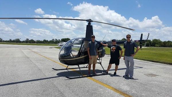 One of our students and 2 flight instructors doing training in the R-22 helicopter