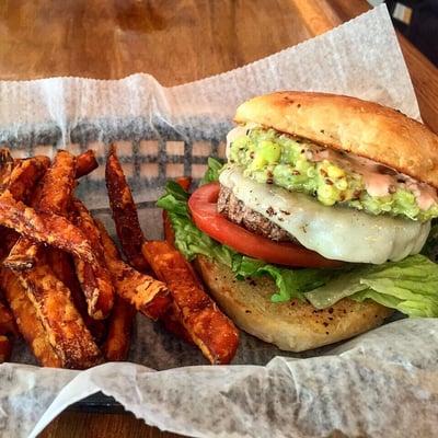 Siwichi S3 Burger Lettuce,tomato,beef or veggie patty, onions, quinoa avocado cream, strawberry rocoto aioli, in a pineapple coconut bun