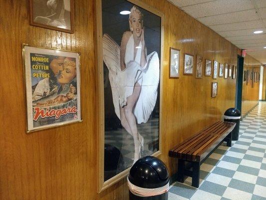 Golden age of cinema memorabilia lines the walls.