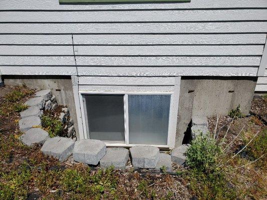 Before new windows were installed new siding and this is the old landscape around the house