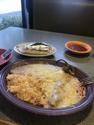 Chile relleno with rice & beans. Taco and salsa towards the back.