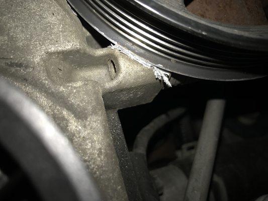 Power steering pulley cutting into timing chain cover