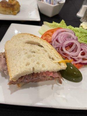 Half roast beef sandwich.   We shared a sandwich so waiter brought half on each plate.