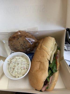 Club poboy with potato salad and a cookie