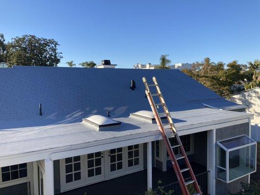 We painted this asphalt shingles roof using Rust Oleum Elastomeric protective coating, looks great!