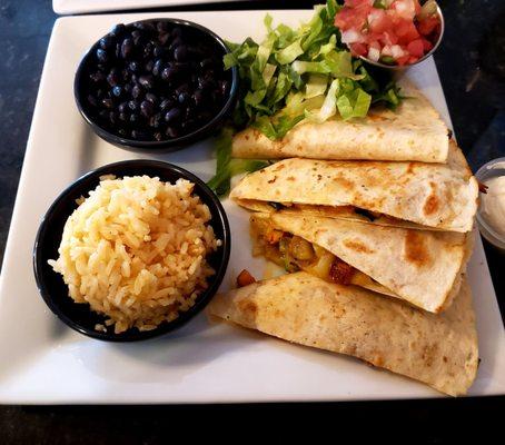 Veggie Quesadilla - includes black beans, rice, pico, and sour cream.