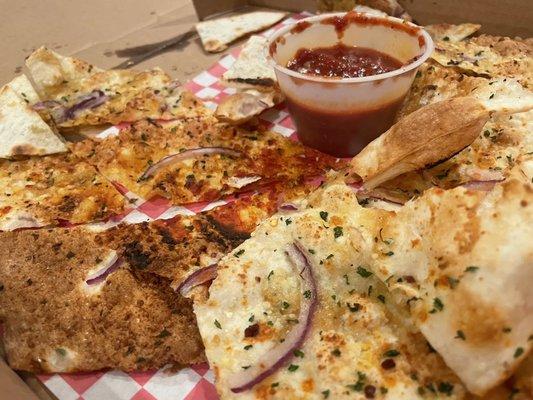 Flatbread with sauce (got tipped enroute).  Not what we expected, but was fine.