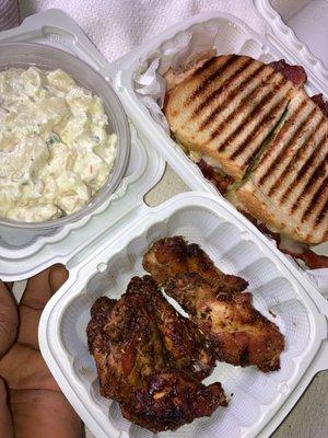 Garlic herb wings and California panini, with a side potato salad