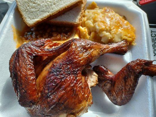 Chicken plate with mac and cheese and baked beans.