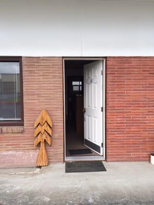 Front door with nice little trees.