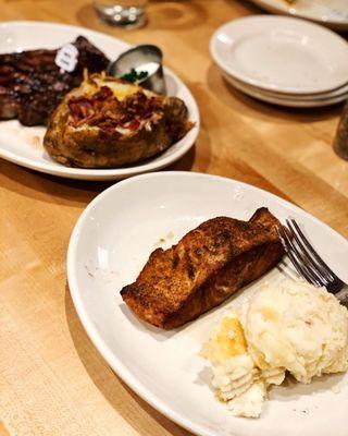 Our Delicious Anniversary Dinner. Salmon and Creamy Mashed Potatoes And New York Steak and Loaded Baked Potato.