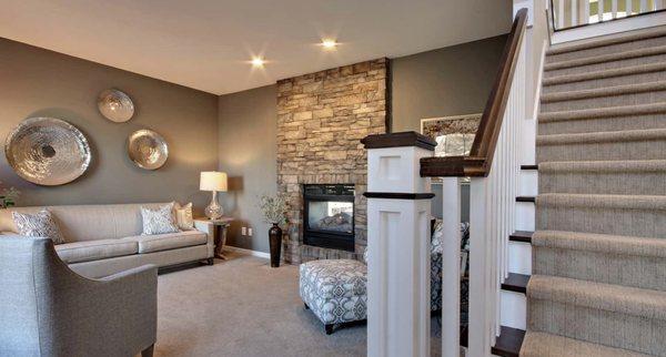 Great accents to soften of room up, even with a stone fireplace